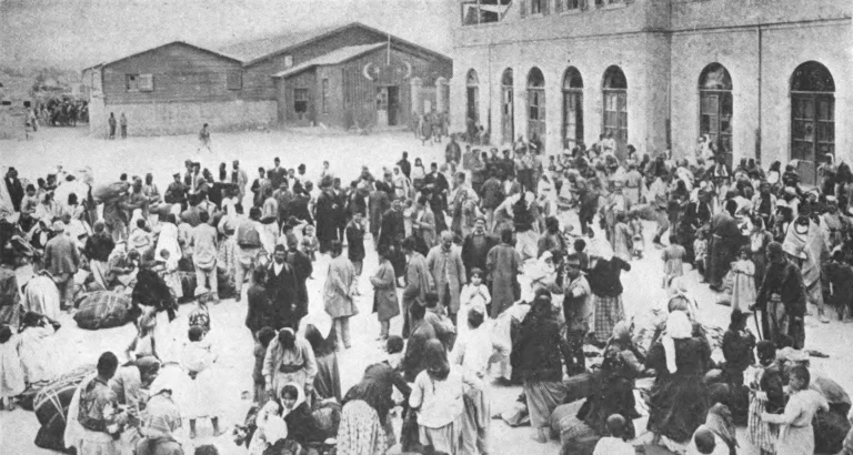 Armenians of a prosperous city assembled in front of a government building, by order of the authorities. They are waiting to be deported. Just outside the city they were massacred