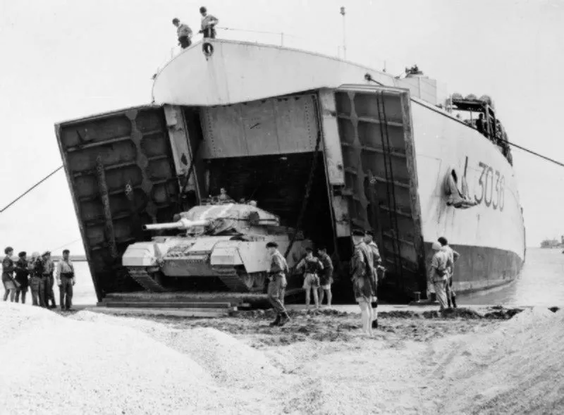 British Centurion tank of the 6th Royal Tank Regiment disembarks from the tank landing ship HMS Puncher (L3036) at Port Said.