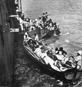 French warship picking up a boat full of Armenian refugees fleeing from the massacre of their people by Turkish forces during WWI 1915