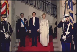 The Shah of Iran, President Nixon, and Mrs. Nixon in formal attire for a state dinner in the White House