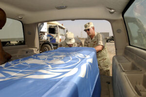 Flag over the transfer casket of UN Chief Ambassador to Iraq, Sergio Vieira de Mello, prior to a memorial service at the Baghdad International Airport. Sergio Vieira de Mello was a victim of a suicide truck bombing at the United Nations Office of Humanitarian Coordinator in Baghdad, Iraq