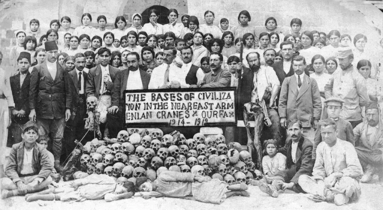 Skulls of Armenians massacred in Urfa, surrounded by Armenian dignitaries and women from the women's shelter in Urfa's Monastery of St. Sarkis in June 1919