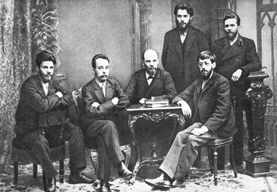 From left to right (standing) : P. K. Zaporozhets, A. A. Vaneyev. (sitting) : Victor V. Starkov, Gleb Krzhizhanovsky, Vladimir Lenin and Julius Martov. Saint Petersburg, 1897