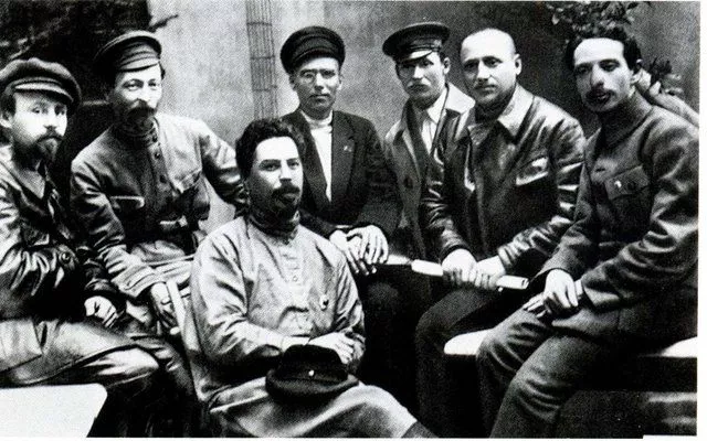 Dzerzhinsky is among the responsible employees of the Cheka. From left to right: Sergey Gerasimovich Uralov, F. E. Dzerzhinsky, Volobuev, Mikhail Ivanovich Vasiliev-Yuzhin, Ivan Ksenofontovich Ksenofontov, Grigory Semenovich Moroz, Vasily Ivanovich Savinov