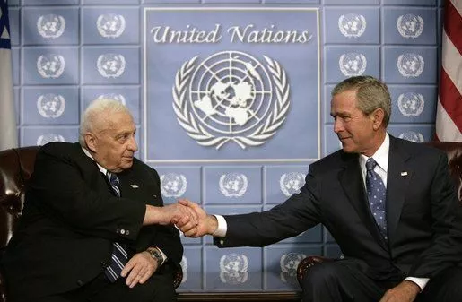 President George W. Bush and Prime Minster Ariel Sharon of Israel greet each other during their meeting at the United Nations in New York, Sept. 14, 2005