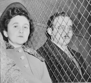 Julius and Ethel Rosenberg, separated by heavy wire screen as they leave U.S. Court House after being found guilty by jury 1951