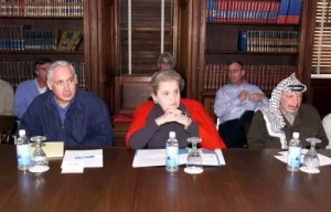 Secretary of State Madeleine Albright (C), Israeli Prime Minister Benjamin Netanyahu (L) and Palestinian leader Yasser Arafat (R) in Houghton House at the Wye River Conference Center, during the Wye River Memorandum talks