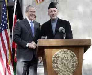 U.S. President George W. Bush and Afghan President Hamid Karzai appear together March 2006, at the Presidential Palace in Kabul, Afganistan