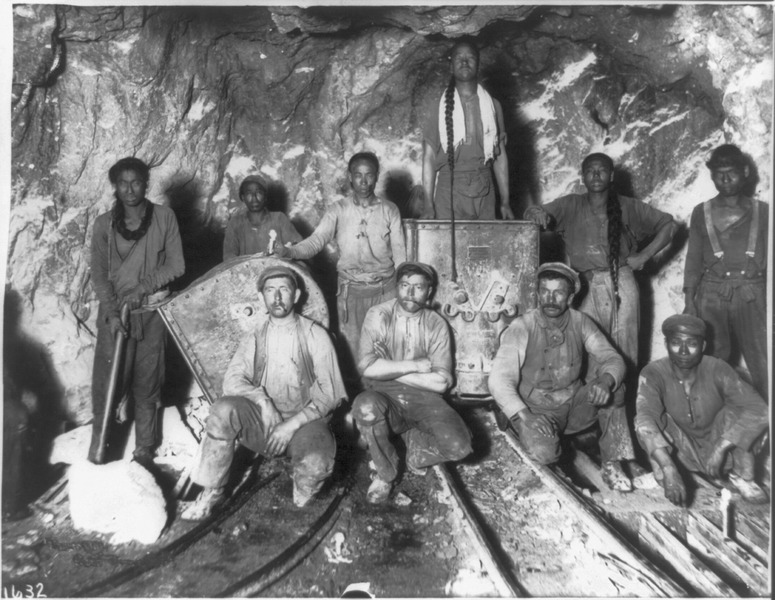 Black, Chinese and White laborers in a gold mine in South Africa