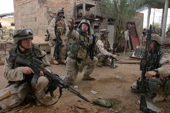 United States Marines carrying M16A4 rifles with fixed OKC-3S bayonets in Fallujah, Iraq November 2004