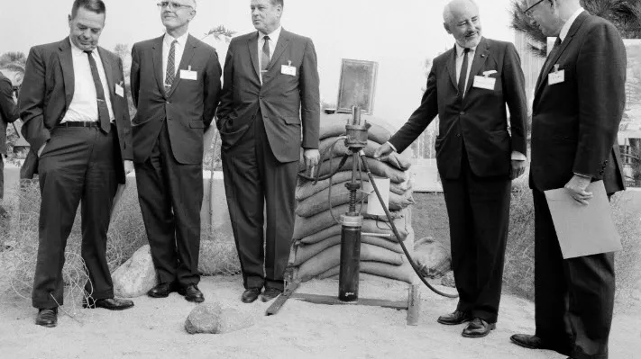 JPL celebration of the 32nd anniversary of the first rocket motor tests (October 31, 1968). Posing with the replica of the first rocket motor test stand, from left to right, William C. Rockefeller, William A. Bollay, Edward S. Forman, Frank J. Malina, and Apollo M.O. Smith.