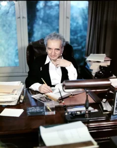 Dr. von Kármán, posed in his office chair 30 March 1957