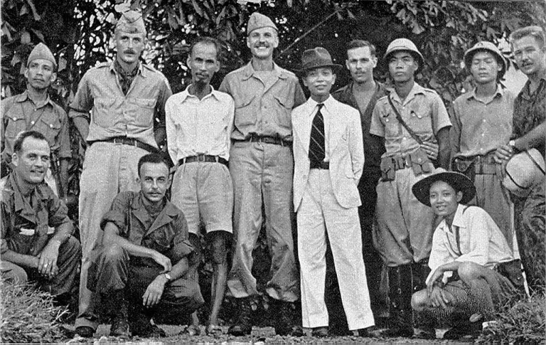 Ho Chi Minh in 1945 (fifth from left standing) with the OSS Deer Team (from l. to r.: Rene Defourneaux, (Ho), Allison Thomas, (Giap), Henry Prunier and Paul Hoagland, far right. Kneeling, left, are Lawrence Vogt and Aaron Squires)