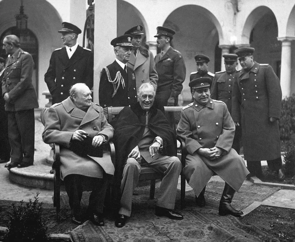 British Prime Minister Winston Churchill, U.S. President Franklin Roosevelt, and Soviet General Secretary Joseph Stalin meet at the Yalta Conference, circa February 1945