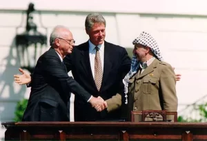 Israeli Prime Minister Yitzhak Rabin, U.S. president Bill Clinton, and PLO chairman Yasser Arafat.