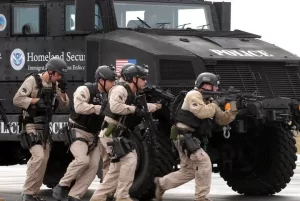 Special Response Team (SRT) within Homeland Security Investigations (HSI) of the U.S. Immigration and Customs Enforcement (ICE) participates in a rigorous training exercise utilizing an armored vehicle at Fort Benning in Georgia.