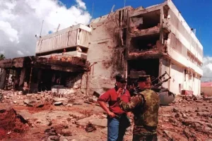 August 1998: The U.S. Embassy in Dar es Salaam, Tanzania, in the aftermath of the August 7, 1998, al-Qaida suicide bombing. Eleven Tanzanians, including 7 Foreign Service Nationals, died in the blast, and 72 others were wounded. The same day, al-Qaida suicide bombers launched another near-simultaneous attack on the U.S. Embassy in Nairobi, Kenya, which killed 218 and wounded nearly 5,000 others