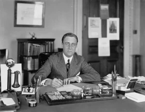 Assistant Secretary of the Navy Franklin D. Roosevelt, at his Navy Department desk