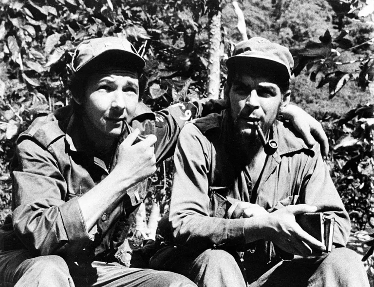 Raúl Castro, left, with has his arm around second-in-command, Ernesto “Che” Guevara, in their Sierra de Cristal Mountain stronghold south of Havana, in 1958 during the Cuban Revolution.