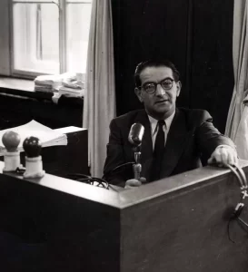 Rudolf Kastner (1906–1957) in broadcasting booth at Kol Yisrael, official Israeli state radio station, where he hosted a program in Hungarian