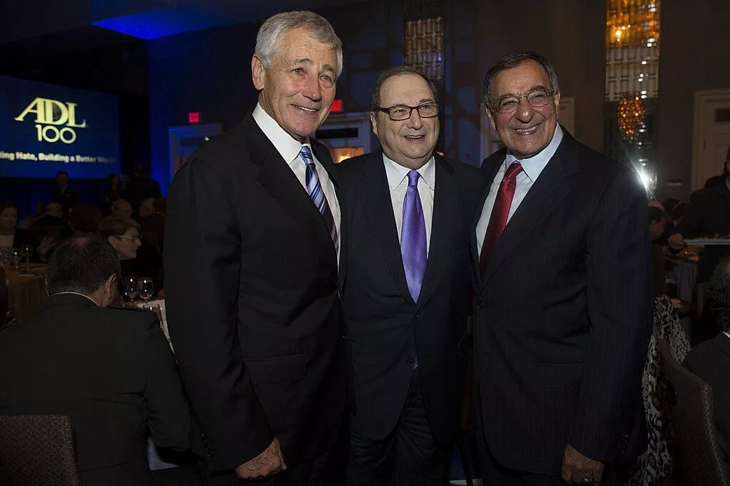 Secretary of Defense Chuck Hagel stands with former Secretary of Defense Leon Panetta and Anti-Defamation League National Director Abraham Foxman