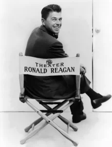 Ronald Reagan sitting in General Electric Theater director's chair