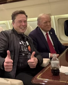 Elon Musk and a blurry Donald Trump