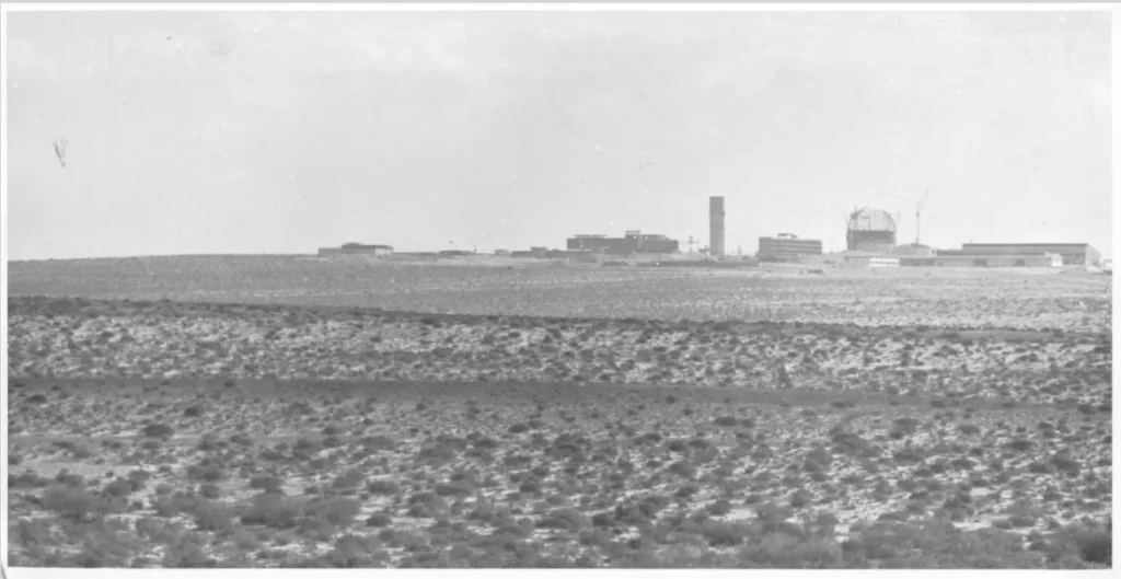 Photograph of the construction site near Dinoma in the Negev desert for Israel's then-secret nuclear reactor were taken during the last months of 1960. The British and U.S. military attachés took photos and these could be from either source. The plainly visible reactor dome undermined Israeli claims that a textile factory was under construction. These images of the reactor site, some of them originally classified secret or confidential, are located in State Department records at the National Archives.