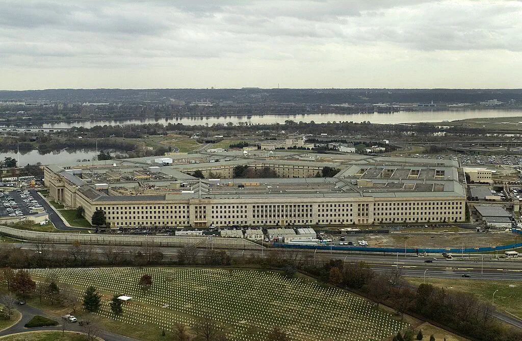Aerial view of the headquarters of the United States Department of Defense (The Pentagon) located between the Potomac River and Arlington National Cemetery. Section 69 of the cemetery is visible at bottom. Navy photo by Chief Photographer's Mate Johnny Bivera.