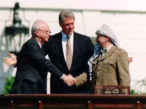 Israeli Prime Minister Yitzhak Rabin, U.S. president Bill Clinton, and PLO chairman Yasser Arafat.