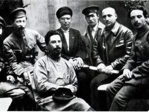 Dzerzhinsky is among the responsible employees of the Cheka. From left to right: Sergey Gerasimovich Uralov, F. E. Dzerzhinsky, Volobuev, Mikhail Ivanovich Vasiliev-Yuzhin, Ivan Ksenofontovich Ksenofontov, Grigory Semenovich Moroz, Vasily Ivanovich Savinov