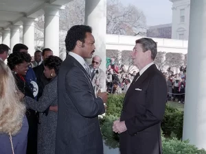 English: President Ronald Reagan Meeting with Jesse Jackson and Lieutenant Andrew Goodman Who Was Captured on December 4, 1983 During a Bombing Raid Against Syrian Antiaircraft Positions in Lebanon on The Colonnade, 1/4/1984